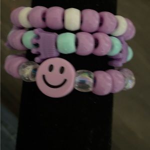 Bracelet set of three purple and clear.